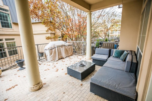 view of patio / terrace with area for grilling, outdoor lounge area, and a balcony