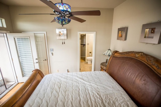 bedroom featuring ceiling fan and ensuite bath