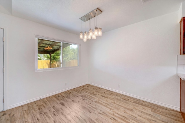 unfurnished room featuring light wood-type flooring