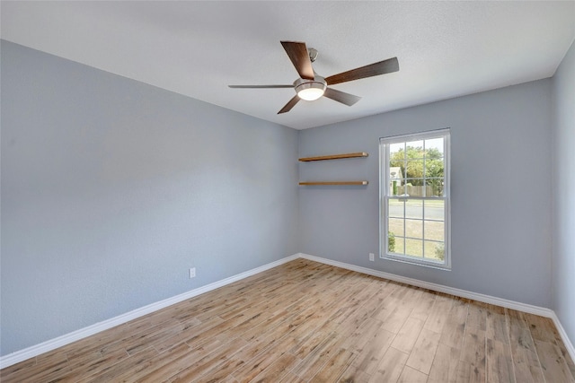 unfurnished room with a textured ceiling, ceiling fan, and light hardwood / wood-style flooring