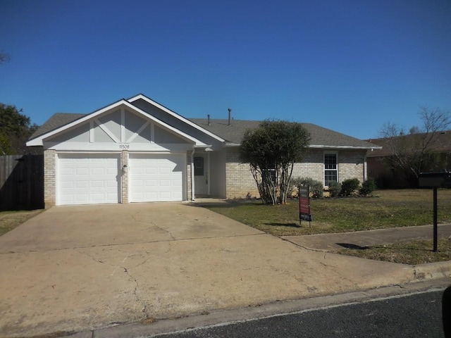 ranch-style house with a garage and a front lawn