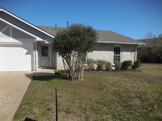 ranch-style house with a garage and a front yard