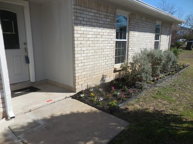 view of side of property featuring a patio area