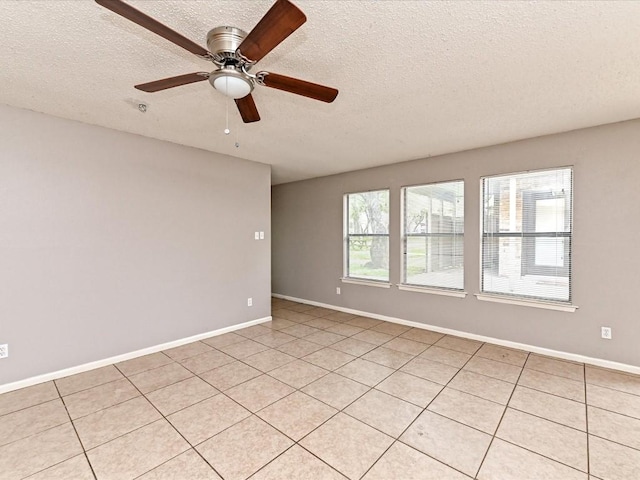 spare room with ceiling fan and a textured ceiling