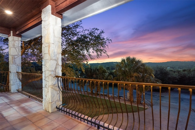 view of balcony at dusk