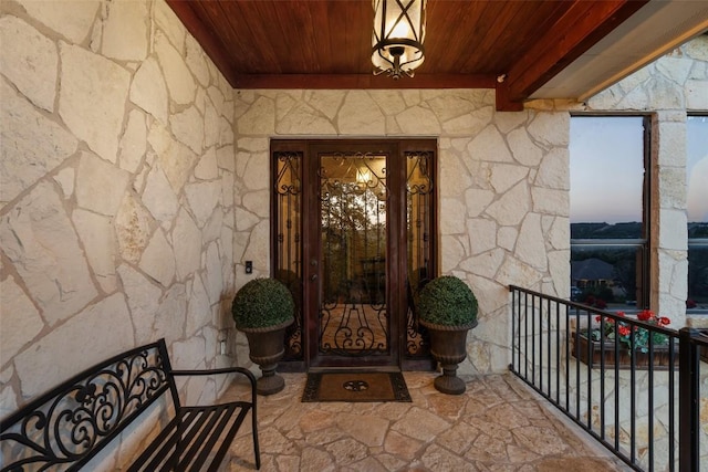201 Cowal Dr N, Spicewood, TX 78669 - doorway to property with stone siding