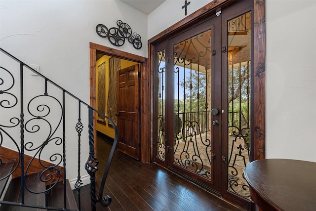 entrance foyer with french doors and dark wood-type flooring