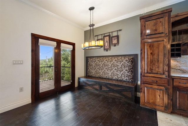 201 Cowal Dr N, Spicewood, TX 78669 - dining area with french doors, baseboards, crown molding, wood finished floors, and a chandelier