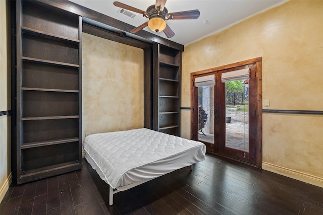 bedroom with ceiling fan, dark hardwood / wood-style floors, and access to outside