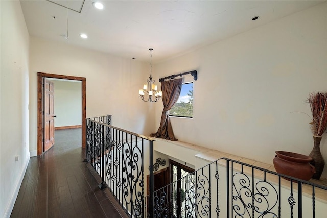 201 Cowal Dr N, Spicewood, TX 78669 - hall featuring attic access, wood finished floors, a chandelier, recessed lighting, and an upstairs landing