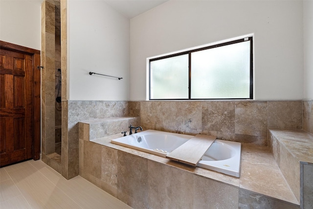 bathroom featuring separate shower and tub and tile patterned flooring