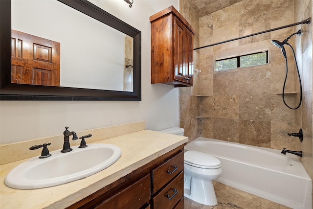 full bathroom with vanity, toilet, and tiled shower / bath combo