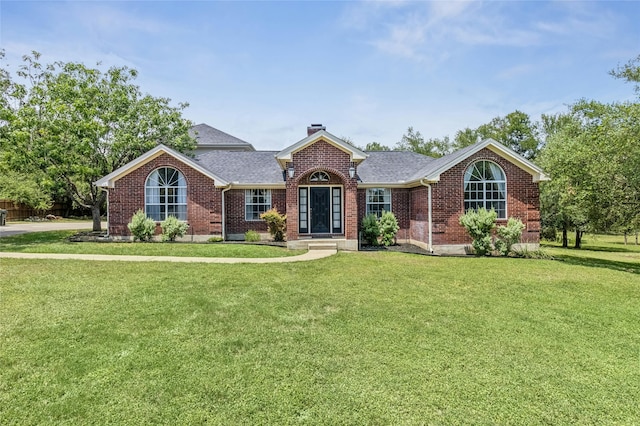 single story home with a front lawn