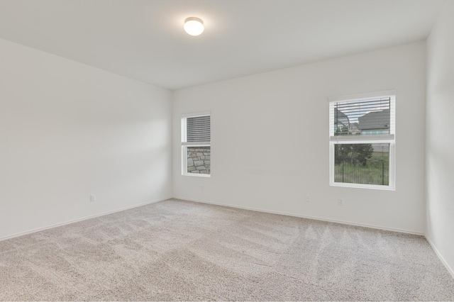 empty room with light colored carpet