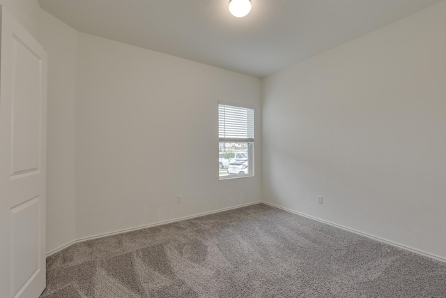 unfurnished room featuring carpet flooring