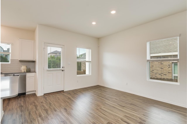 unfurnished dining area with hardwood / wood-style floors