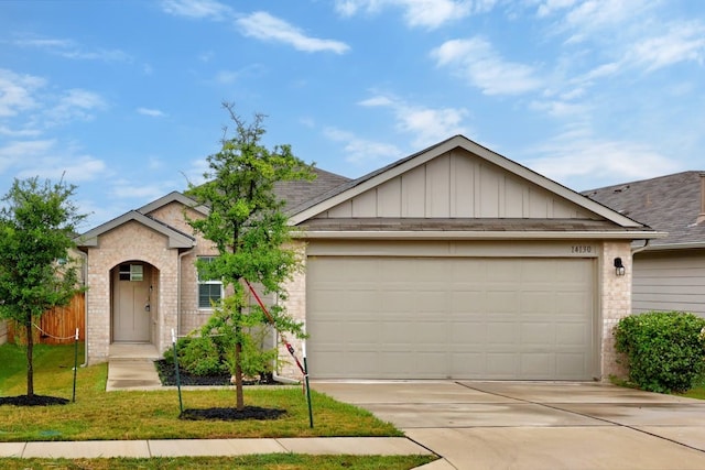 ranch-style house featuring a garage and a front yard