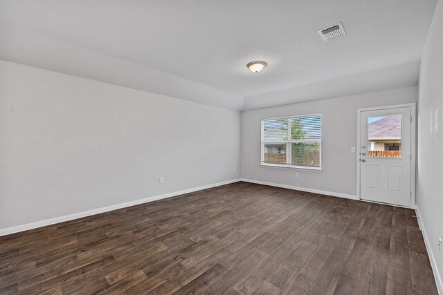 empty room featuring dark hardwood / wood-style floors