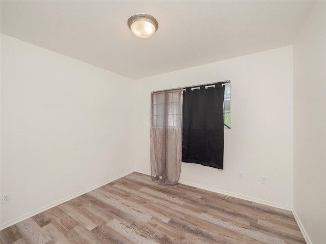 spare room with light wood-type flooring