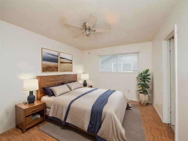 bedroom featuring light parquet flooring and ceiling fan