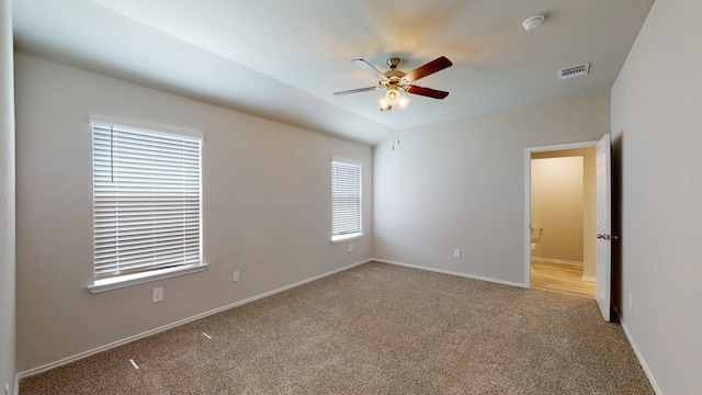 carpeted empty room featuring ceiling fan