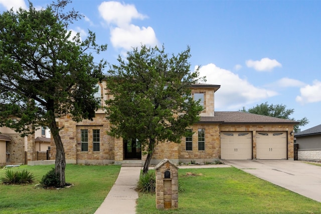 view of front facade with a garage and a front yard