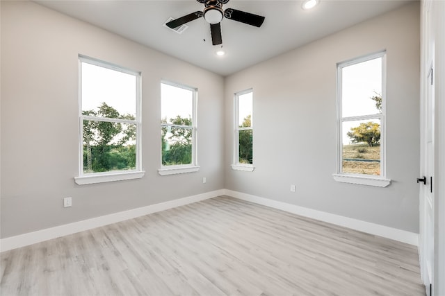 spare room with light hardwood / wood-style floors and ceiling fan