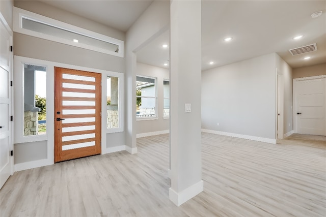 entrance foyer featuring light hardwood / wood-style flooring and a wealth of natural light