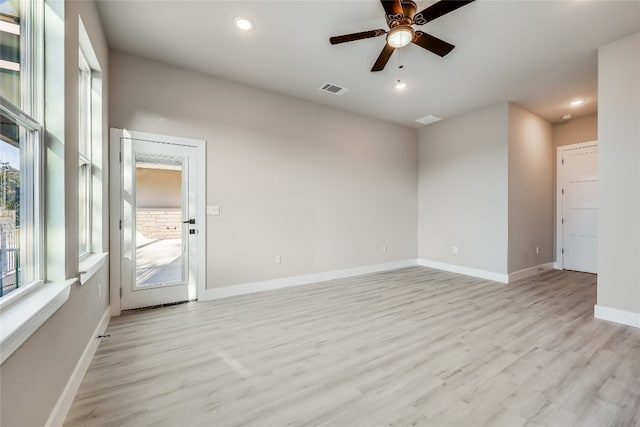 unfurnished room featuring ceiling fan and light wood-type flooring