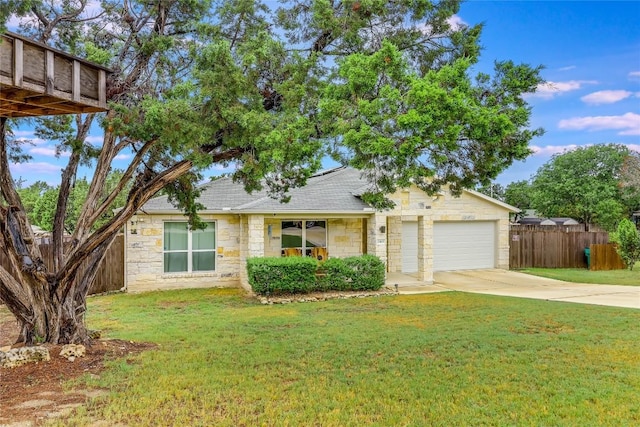 20400 Bear Rd, Lago Vista, TX 78645 - view of front facade with concrete driveway, fence, a front lawn, and stone siding