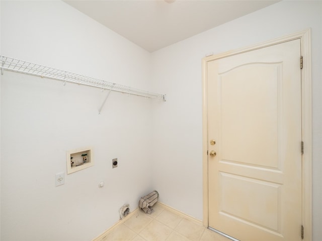 laundry area featuring washer hookup, gas dryer hookup, electric dryer hookup, and light tile patterned floors