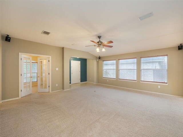 carpeted spare room with ceiling fan