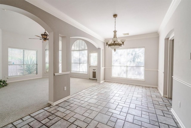 empty room with crown molding, ceiling fan with notable chandelier, and light colored carpet