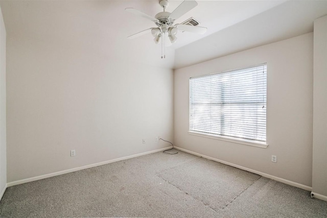 carpeted empty room featuring ceiling fan