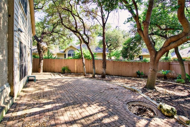 6 Muirfield Greens Cv, Lakeway, TX 78738 - fenced backyard featuring a patio area