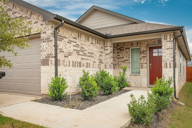 view of exterior entry featuring a garage