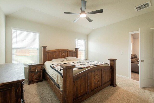 bedroom featuring light carpet, ceiling fan, and lofted ceiling