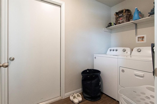 laundry room featuring dark wood-type flooring and washing machine and clothes dryer