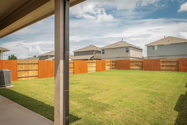 view of yard featuring central AC