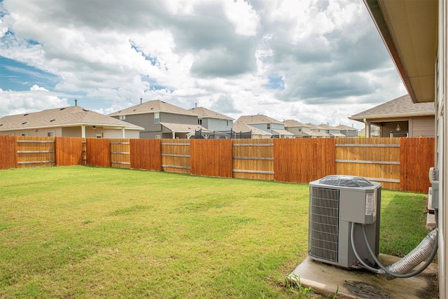 view of yard with central air condition unit