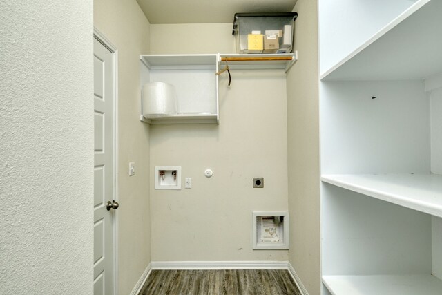 laundry room featuring hookup for a washing machine, gas dryer hookup, electric dryer hookup, and hardwood / wood-style floors