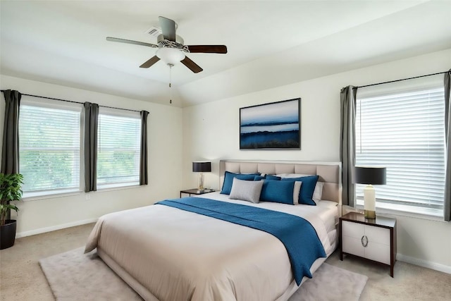 carpeted bedroom with lofted ceiling and ceiling fan