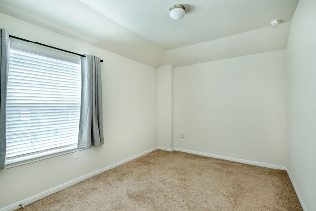 empty room with a healthy amount of sunlight and light colored carpet