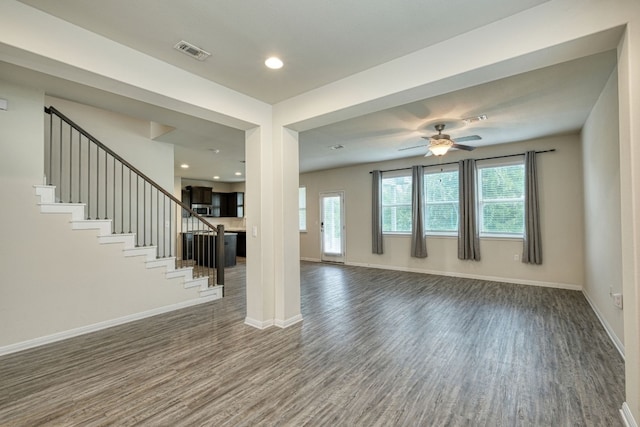 unfurnished living room with ceiling fan and hardwood / wood-style floors