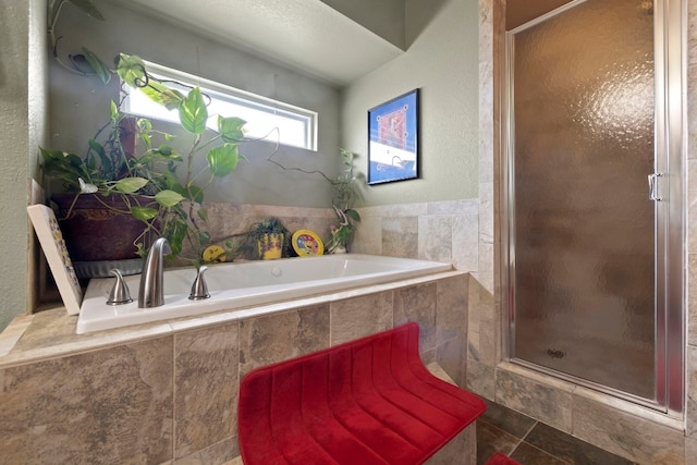 bathroom featuring independent shower and bath and tile patterned flooring