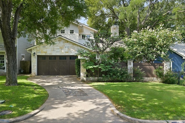 view of front facade with an attached garage, fence, stone siding, concrete driveway, and a front lawn