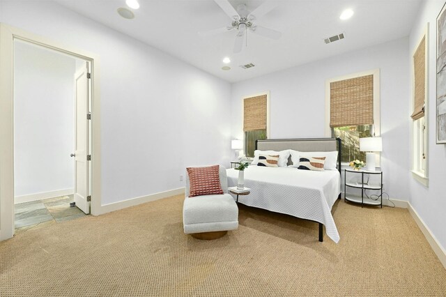 carpeted bedroom featuring ceiling fan