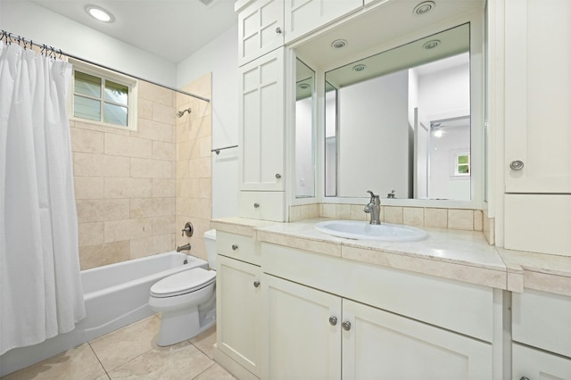 full bathroom featuring vanity, toilet, shower / bathtub combination with curtain, and tile patterned floors