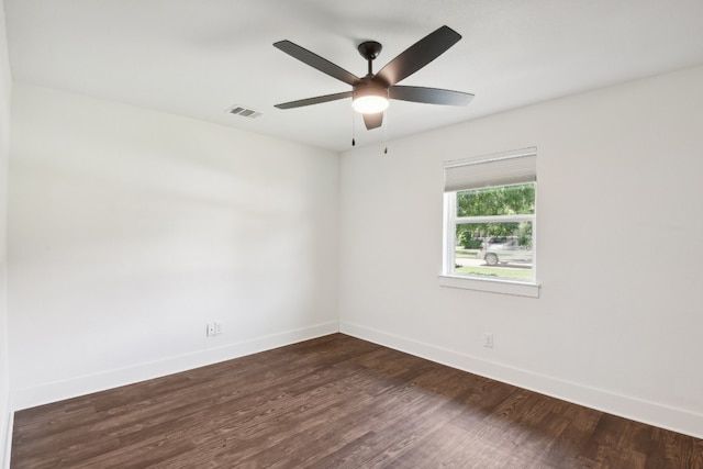 unfurnished room featuring dark hardwood / wood-style flooring and ceiling fan