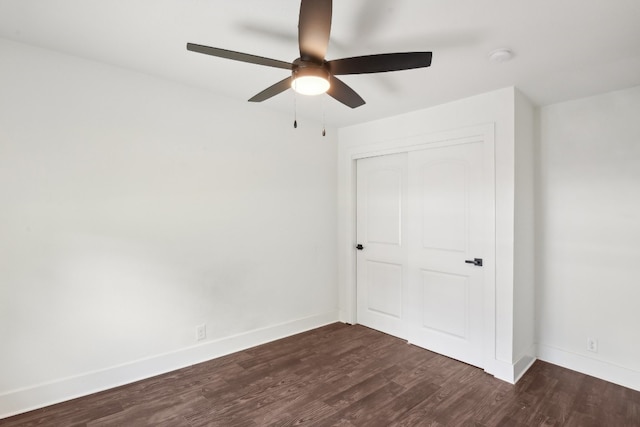 unfurnished bedroom with hardwood / wood-style flooring, a closet, and ceiling fan